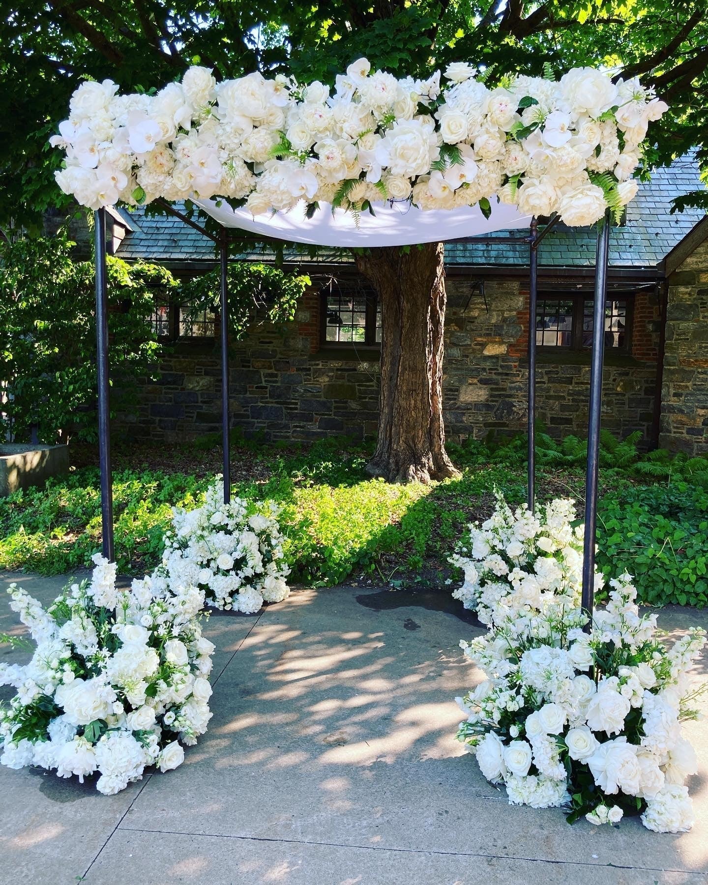 Wedding chuppah floral installation at Blue Hill at Stone Barns, designed by Perennial Gardens