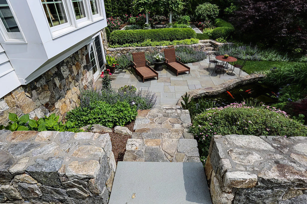 Bluestone hardscape with stone retaining walls