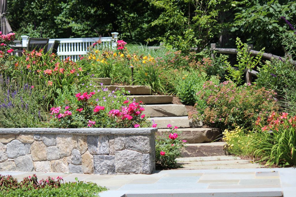Flowering perennial garden with stone border