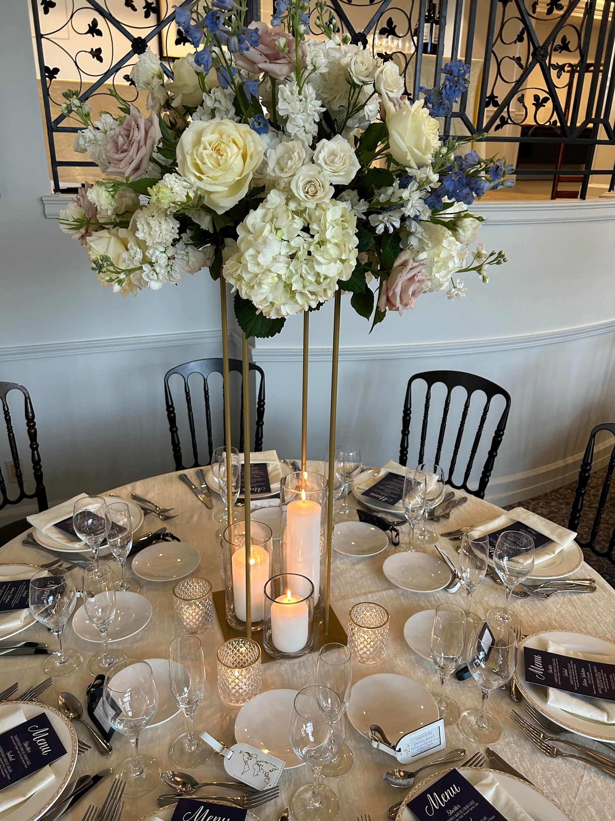 Elevated white and blue arrangement for a corporate reception