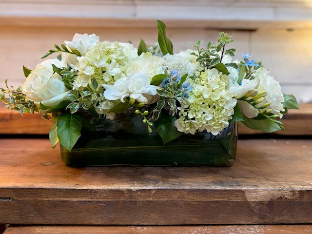 Rosh Hashanah Centerpiece — white Mondial roses, freesia and pale green mini hydrangea in a low glass container