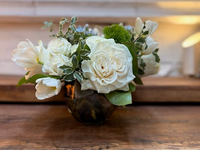 Shanah Tovah! — white roses, spray roses, tulips, green Trick and blue Tweedia in a faceted smoked glass bowl